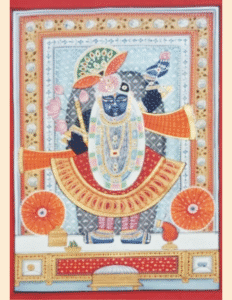 Pichwai painting of Shrinathji in orange attire with lotus garland, traditional Rajasthani hand-painted art.