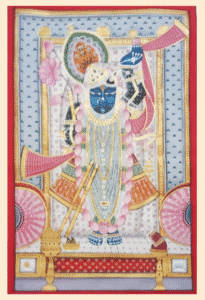 Pichwai painting of Shrinathji with pink lotus garland, blue attire, and golden frame.