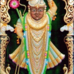 Shrinathji Rajbhog golden hand-painted wooden artwork with ornate carved frame.