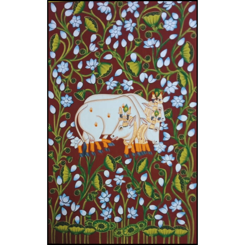Handpainted Pichwai cow painting featuring two decorated cows surrounded by white lotus flowers on a red background – traditional Indian Nathdwara art