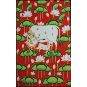Handmade Pichwai painting of cow and calf with lotus motifs on a red background – traditional Indian art